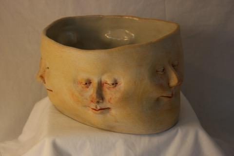 Bowl of many faces by artist Jenn Peren